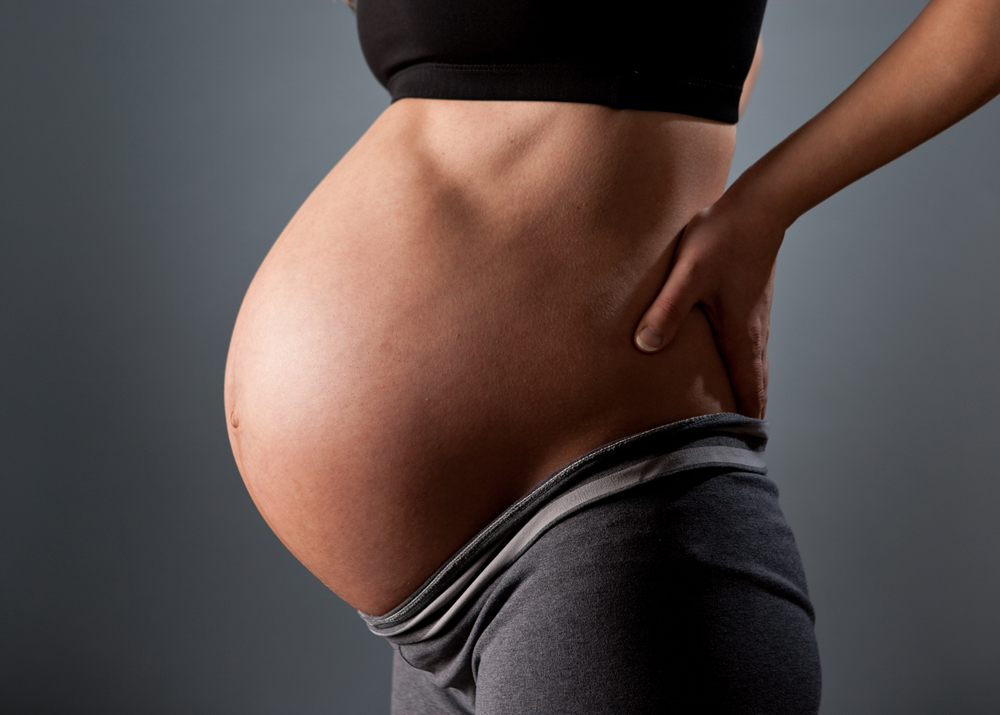 Pregnant women is in aches and pains during pregnancy and needs a Knoxville pregnancy chiropractor